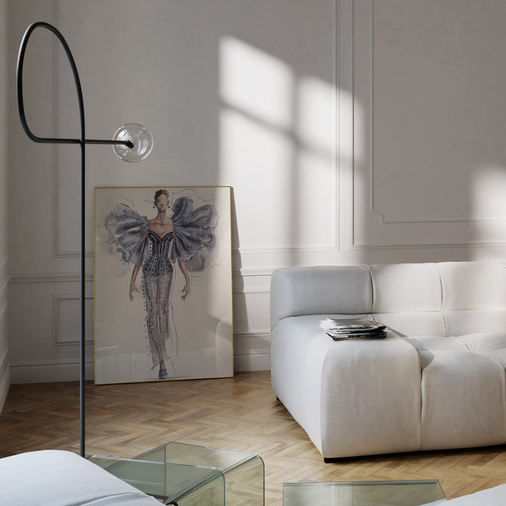 Modern living room with a white sofa and fashion illustration wall art.