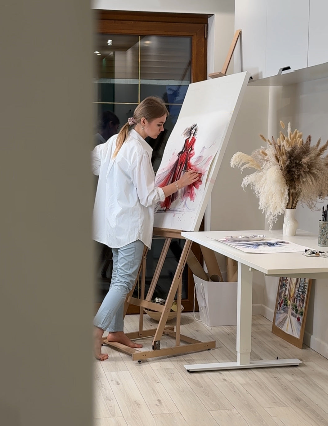 Fashion illustrator painting on red dress fashion illustratio